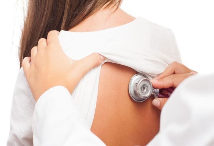 doctor's examination for pain in the shoulder blades